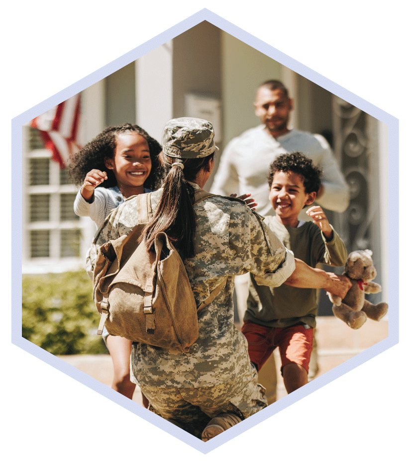 military servicewoman hugging family US Family Health Plan (USFHP) services military health plan